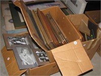 Large group of picture frames of various sizes.