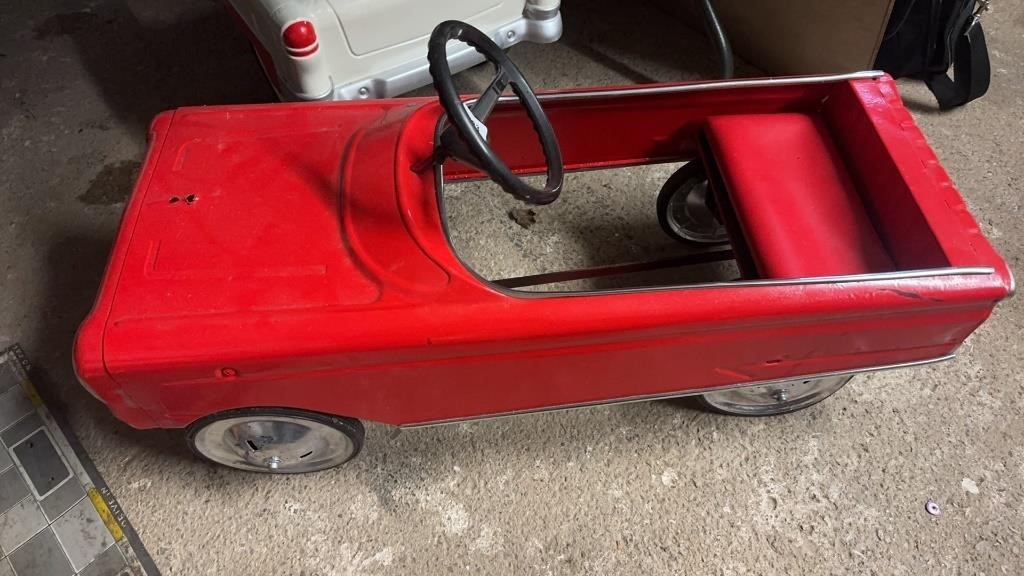 Red pedal car