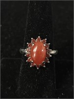 STERLING RING WITH RED ORANGE CENTER STONE