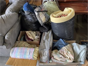 Skid of bedding, pillows, misc