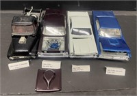 Four plastic models. Includes a 1953 Ford