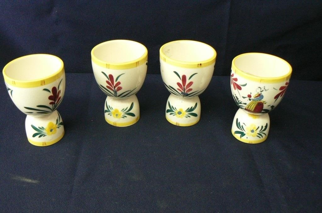 FOUR ANTIQUE QUIMPER STYLE EGG CUPS