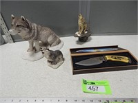 Wolf knife and wolf statues