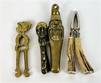 FOUR VINTAGE BRASS AND HORN NUTCRACKERS
