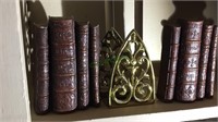 2 pair of bookends, brass and stacked books,