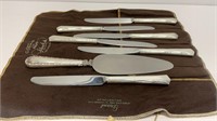(6) butter knives and (1) pie knife with