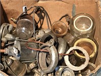 Assortment of glass fuel filter bowls and parts.