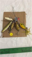 Fishing lures with treble hooks.