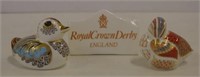 Two Royal Crown Derby paperweights & display sign