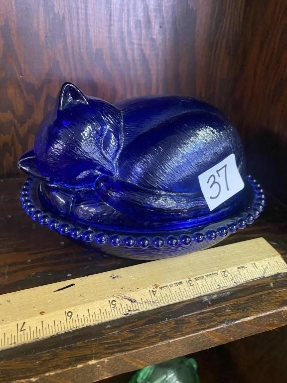 Indiana glass cobalt blue cat on bed