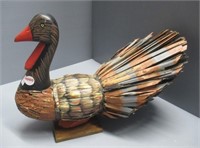 Decorative bird. Measures: 11" H x 14.5" W.