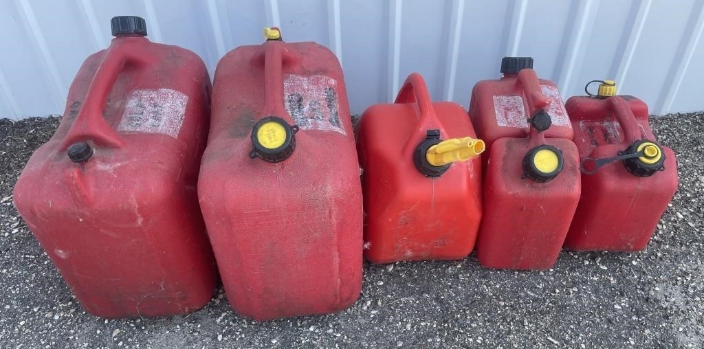 Selection of 5 plastic gas cans.