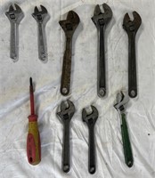 8 various size crescent wrenches and 1 screwdriver