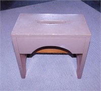 Wooden step stool painted brown,