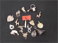 16 Sterling silver charms 31 grams