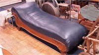 Vintage oak fainting couch with carved base and