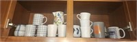 Cabinet lot of misc coffee cups