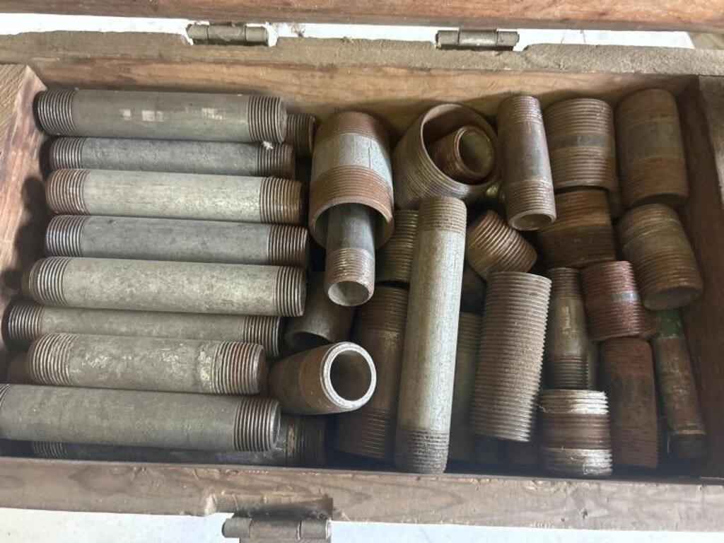 Wooden crates and metal pipe fittings