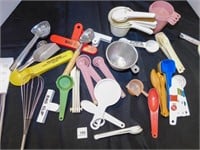 miscellaneous kitchen measuring cups and spoons