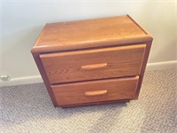 Two drawer oak nightstand 22 inches tall 24