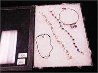 Four bracelets; two are sterling with beads,