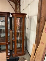 Lighted curio cabinet with glass shelves