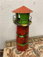 Metal lighthouse hand made of recycled materials
