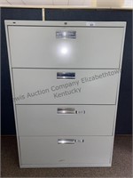 Four drawer filing cabinet all drawers function.