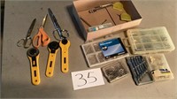 Nails, picture hanging kit, rotary cutters, three