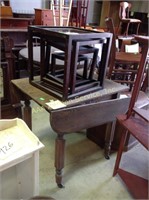 Broken drop leaf table & small nesting tables.