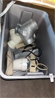 Tote of Metal Fittings and Power Surge Plugs