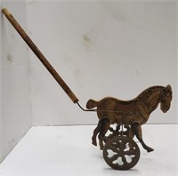 Vintage horse toy on stick. Runs when the wheels