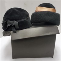 Vintage hat box with two women's hats.