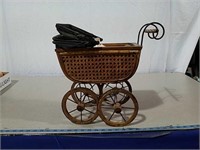 Doll and small wicker buggy
