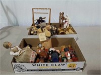 Two boxes smaller ethnic dolls some are wood