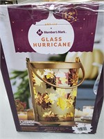 Members mark fall leaves glass hurricane