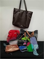 Group of purses, makeup bags, and other
