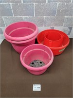 Pink plant pots and red tomato pot
