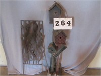 Wood bird houses on stand and metal yard décor