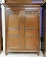 Early 19th Century French Carved Oak Armoire.