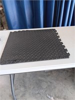 23 black interlocking mats, 23 x 23