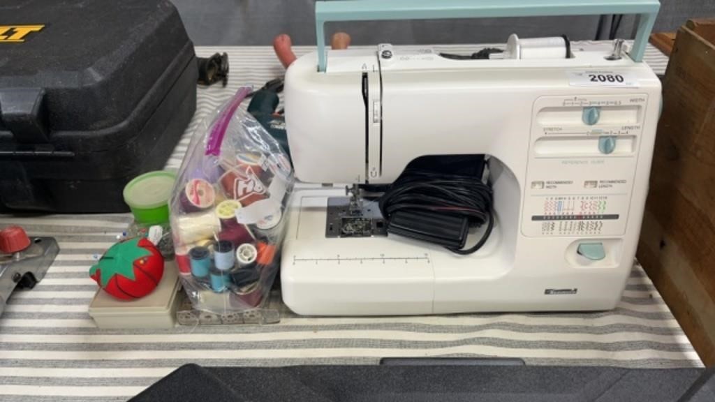 Kenmore sewing machine with accessories