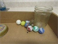 Antique shooter marbles in jar.
