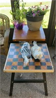 2 tables. One with wooden chessboard top and