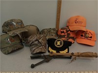 Camo & hunter orange hats & clay pigeon thrower