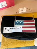 Two small bags and a flag sign