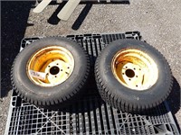 Pair of Turf Master tires on rims; size 23x9.50-12