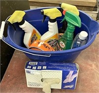 Bucket full of cleaning supplies and plastic