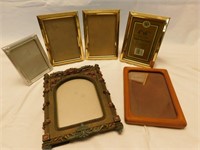 Lot of small stand-up picture frames.