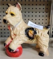 CERAMIC DOG PERCHED ON BALL FIGURE